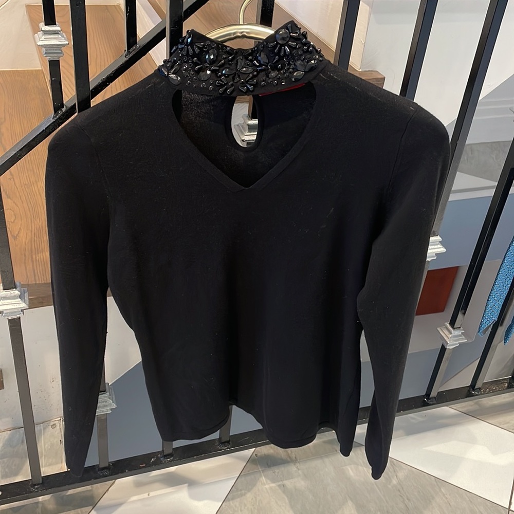 Black knit sweater with jewel embellishment. Size medium